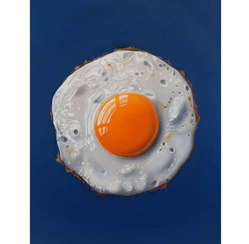 Fried Egg on a Blue Background